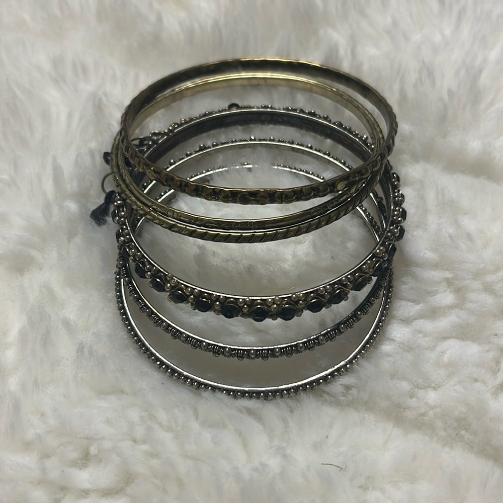 Set Of Six Decorative Gold, And Silvertone Bangles